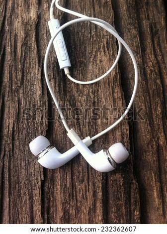 White earphone on the wooden