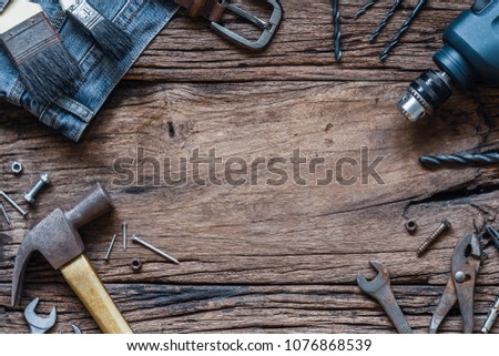 Top view close up of variety handy tools and jeans on wood background with copy space for your text for Worker\'s day, Labor\'s day, labour\'s day background.