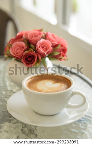 hot coffee and  rose on the table