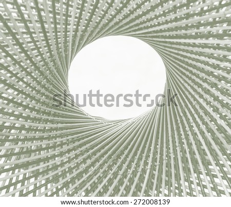 Weave pattern circle and hole in the middle of bamboo background process in tinted photo in violet tone