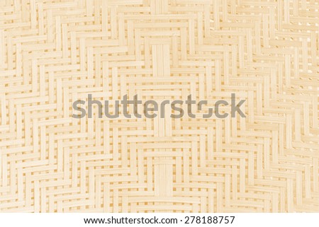 Weave pattern of bamboo background processed in tinted photo in orange tone