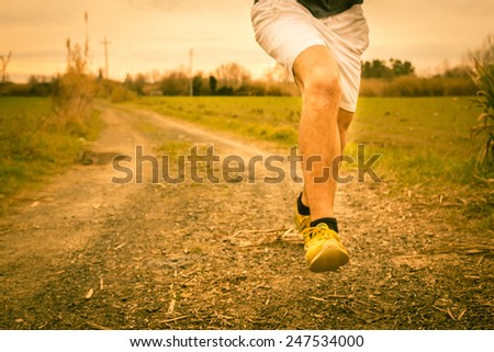 A guy running in the countryside