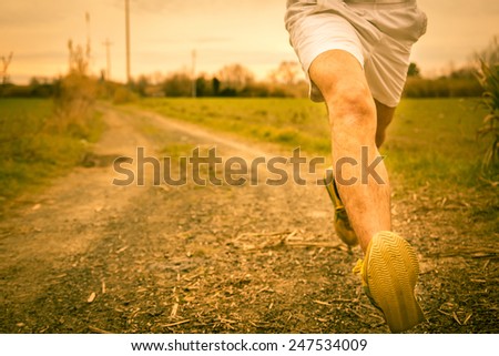 A guy running in the countryside