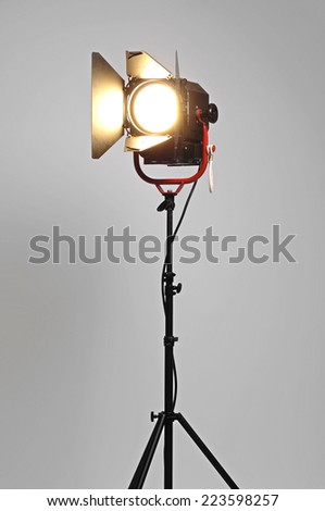 Black Movie Studio Light on a black stand isolated on gray background with real shadow