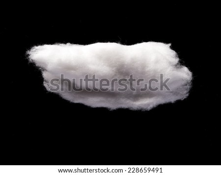 Cotton Wool Cloud isolated in Black Background with Text Space. Clouds Made of Real Cotton