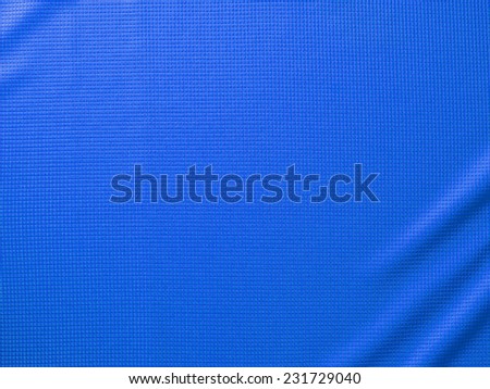 Sport Clothing Fabric Texture Background. Top View of Cloth Textile Surface. Blue Football Shirt. Text Space