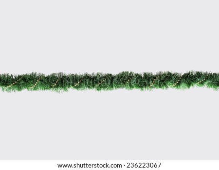 Christmas Garland isolated on Grey Background. Top View of Xmas Decoration Close-Up with Text Space