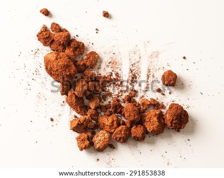 Red Soil isolated on White Background. Pile of Dirt and Stones. Top View of a Heap of Ground. Close Up Macro View