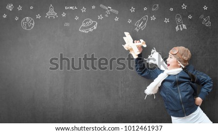 Kid playing in pilot costume has fun with imagination dream flying plane for learning inspiration world in innovative science technology engineering maths STEM education and children's day concept