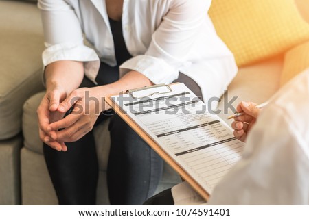 Doctor or psychiatrist consulting and diagnostic examining stressful woman patient on obstetric - gynecological female illness, or mental health in medical clinic or hospital healthcare service center