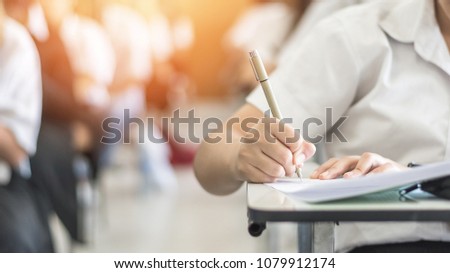 Exam with school student having educational admission test, thinking hard, writing answer in classroom for university education and world literacy day concept