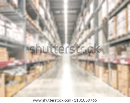 Warehouse industry blur background with  logistic wholesale storehouse, blurry industrial silo interior aisle for furniture merchandise inventory and wood material, construction supplies big box store