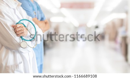Surgeon and anesthetist doctor ER team with medical clinic room background for emergency nursing care professional teamwork and patient trust in hospital\'s hospitality concept
