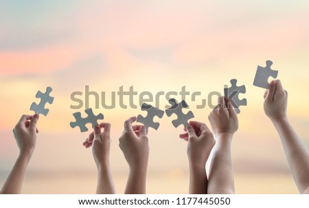 Teamwork idea brainstorming, team partnership connection for problem solving, finding solution in hope concept with puzzle pieces in school children or student kids\'s hands