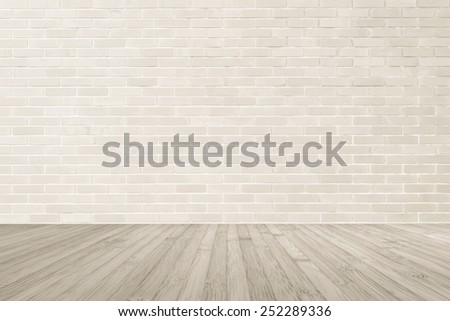Light brown brick wall textured background with wooden floor in sepia brown tone for interiors: Wooden table or tabletop with brick masonry wall texture