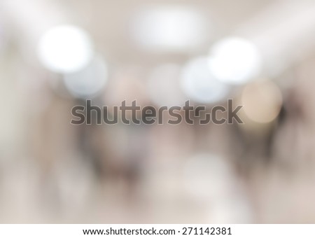 Blurred abstract background of people walking in underground shopping mall in Tokyo