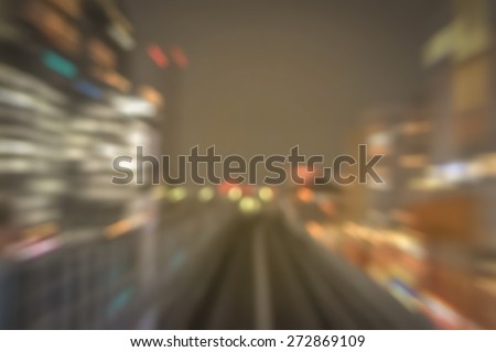 Motion zoom blurred abstract background of Tokyo night bokeh lights on railway