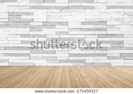 White grey two-tone -color brick tile wall with wooden floor in sepia antique brown color tone for interior background: Stone tiled wall with wooden table or tabletop