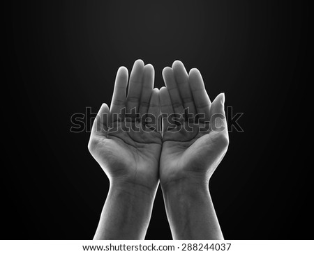 Isolated female empty open human hands with palms raised up in black and white : Pray for spiritual support and helping concept