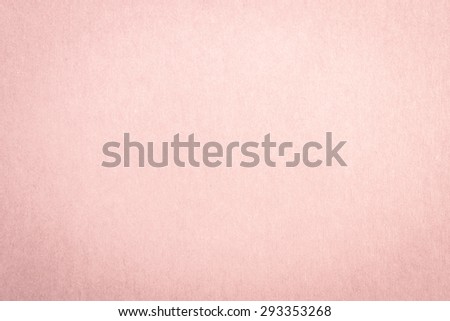 Recycled craft paper textured background in light faded pale pink color tone: Detailed texture of recycled kraft paper fiber in pastel toned style