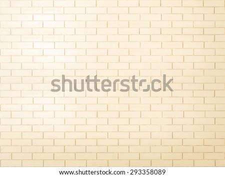 Brick wall tile texture background painted in yellow cream color tone: Tiled brick wall in light yellow beige cream tone