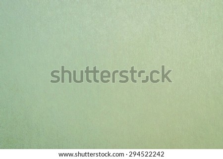 Recycled craft paper textured background in green color tone: Detailed texture of recycled paper fiber