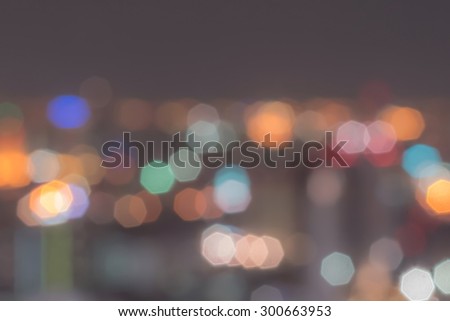 Blurred abstract background of aerial view of city night lights  polygon bokeh in cool vintage color tone: Blurry retro style nightlife natural bokeh of Bangkok downtown central business district