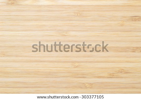 Wooden textured grainy detail backdrop in light sepia cream color tone: Bamboo wood laminated board detailed texture pattern background in sepia creme brown toned colour