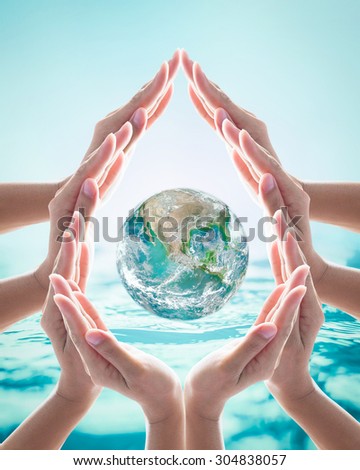 Human hands grouped in aqua droplet shape around green globe on blurred cyan blue wavy water background: Saving water and world environment/ ocean concept: Elements of this image furnished by NASA