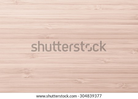 Wooden textured grainy detail backdrop in light red brown color tone: Bamboo wood laminated board detailed texture pattern background in red oak brown toned colour