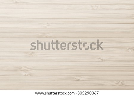 Wooden textured grainy detail backdrop in light sepia cream beige color tone: Bamboo wood laminated board detailed texture pattern background in sepia creme toned colour