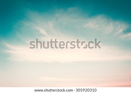 Retro style blurred sky background soft clouds on wind movement: Blurred nature background of cyan blue cloudy sky in vintage color tone