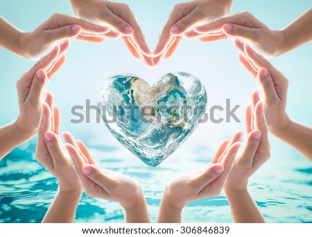Collaborative human hand group heart shape around love green globe on blurred cyan turquoise blue wavy spa water background: Saving water CSR concept idea: Element of the image furnished by NASA