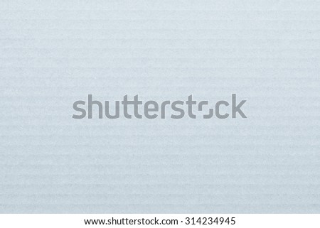 Light white grey blue color tone corrugated cardboard paper texture patterned background: Recycled cardboard textured pattern grunge detailed backdrop in light pastel selenium grey toned colour