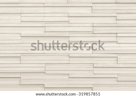 Marble tile wall texture detailed pattern background in light beige creamy creme brown color tone: Modern stone wall tiled patterned detail textured backdrop for interior design and decoration