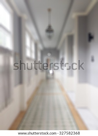 Blurred abstract background of corridor of luxurious building interior in Vintage European Victoria Country style decoration: Blurry perspective view of walk way of luxury hotel with antique decor