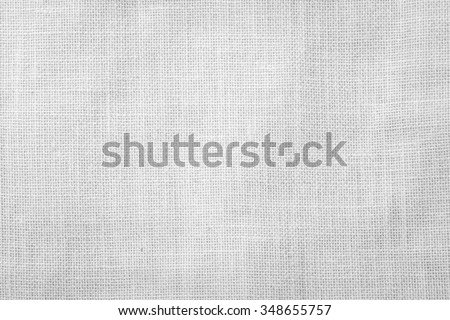 Hessian sackcloth woven texture pattern background in bleached white grey color tone: Eco friendly raw organic flax cloth fabric textile backdrop: Bag rope thread detailed textured burlap canvas