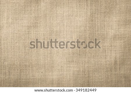 Hessian sackcloth woven texture pattern background in dark cream beige brown color tone: Eco friendly raw organic flax cloth fabric textile backdrop: Bag rope thread detailed textured burlap canvas