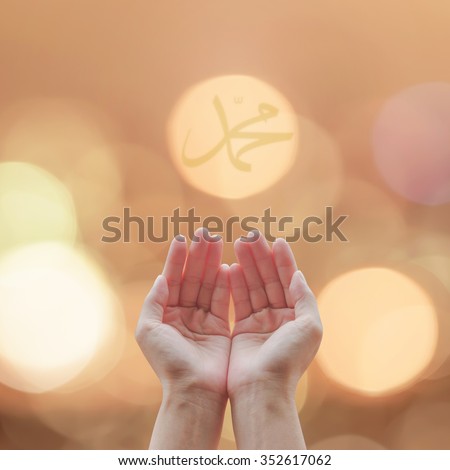Female woman open human hands prayer with palm up and candle night light with calligraphic text representation of Muhammad name: Prophet\'s birthday: Pray for spirit support, destiny, peace concept