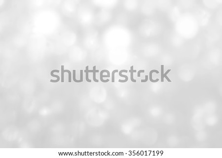 Blurred abstract background reflective white snowy winter miracle bokeh crystal mobile chandelier hanging lamp silver color lighting vintage color tone: Sparkling lights of crystal glass reflection