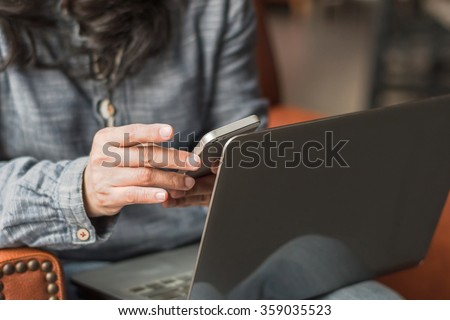 City lifestyle journalist blogger woman working on computer device & smart phone texting in coffee shop Hand keyboard typing: People w/ wifi cyber IT IOT IM PPC communication technology daily life seo