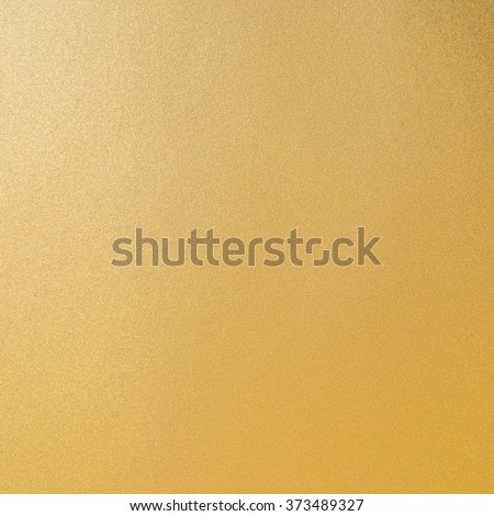 Shiny hot yellow gold foil leaf decorative texture background: Bright brilliant festive glossy metallic look textured backdrop: Aluminium tin metal like material surface for design decoration