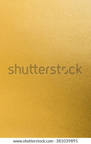 Shiny yellow gold paper golden foil decorative texture background: Bright brilliant festive glossy metallic look textured backdrop: Metal steel like material pattern surface for design decoration