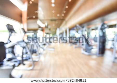 Blur abstract background modern fitness center with health exercise equipment : Blurry perspective view of gym facility service room: Empty gymnasium indoor space for diet, bodybuilding and training