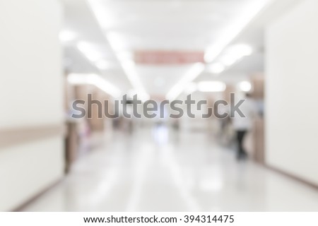 Blurred abstract background of hospital interior waiting hall/ corridor with patient in front of nurse station and OPD - out patient clinic department: Blurry view clinical indoor interior space