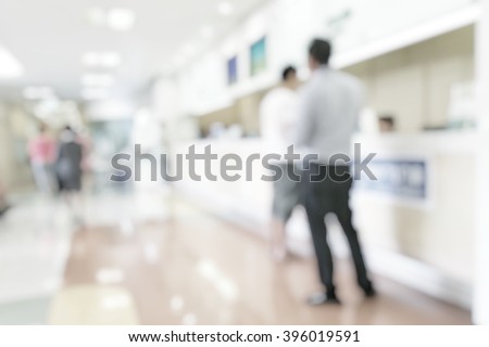 Blur abstract background reception hall customer or patient counter service & cashier desk indoor space in hospital office hotel bank interior: Blurry perspective view information lobby staff working