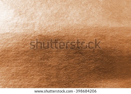 Shiny copper bronze brass paper foil decorative texture background: Bright brilliant festive glossy metallic look textured backdrop: Metal steel like material pattern surface for design decoration