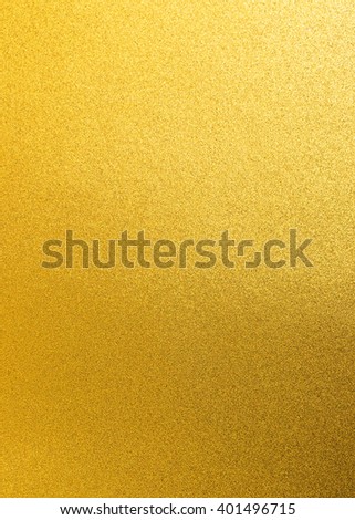 Shiny yellow gold golden paper foil decorative texture background: Bright brilliant festive glossy metallic look textured backdrop:  Metal steel like material pattern surface for design decoration