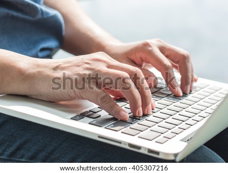 City lifestyle journalist blogger woman working on computer device typing texting in office indoor space Hand keyboard typing People w/ wifi cyber IT IOT IM PPC communication technology daily life seo