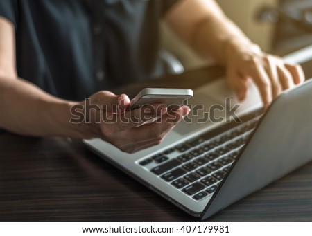Vintage style city lifestyle woman hands working on computer typing laptop keyboard using IOT IT SEO wifi cyber internet online digital media technology pc device in urban office space environment